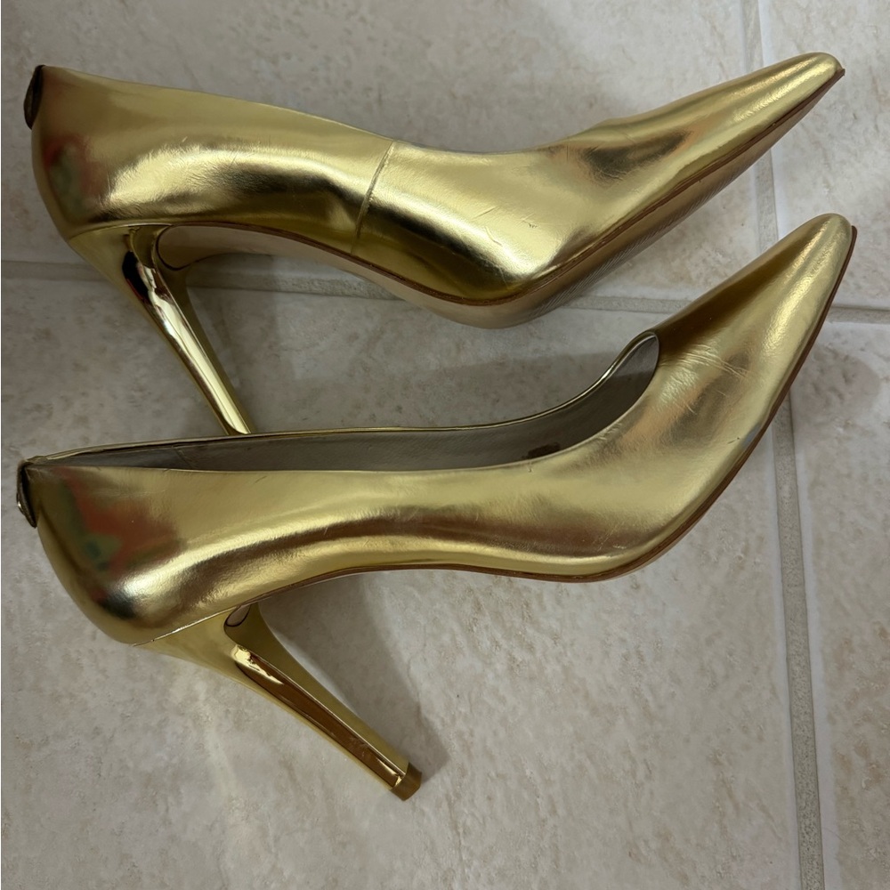 Gold Michael Michael  Kors heels size 8.5 worn once. In amazing condition.